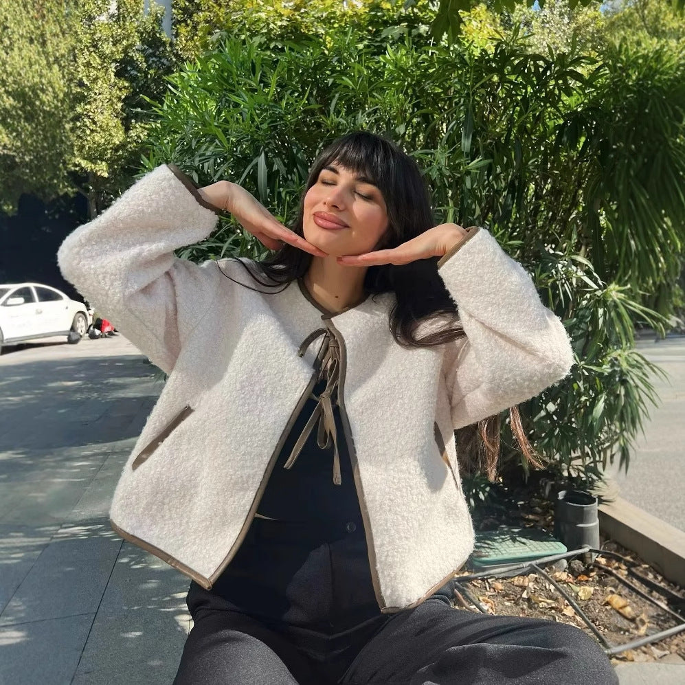 Women short-cut teddy jacket with double-tied bow closure, round neck and contrast piping Mune Fashion