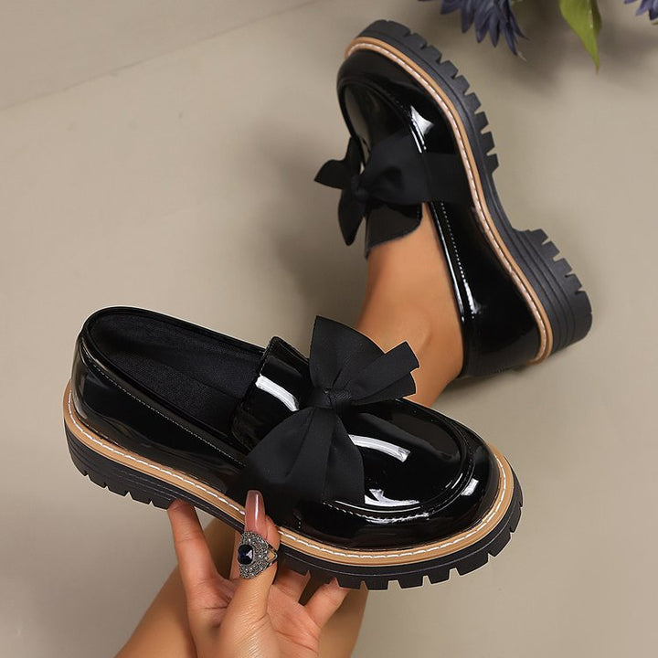 Ladies patent look loafer with massive profile sole and large fabric bow Mune Fashion