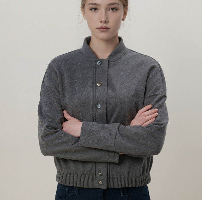 Women's cozy fleece bomber jacket with stand-up collar, ribbed hem, and snap button placket Mune Fashion