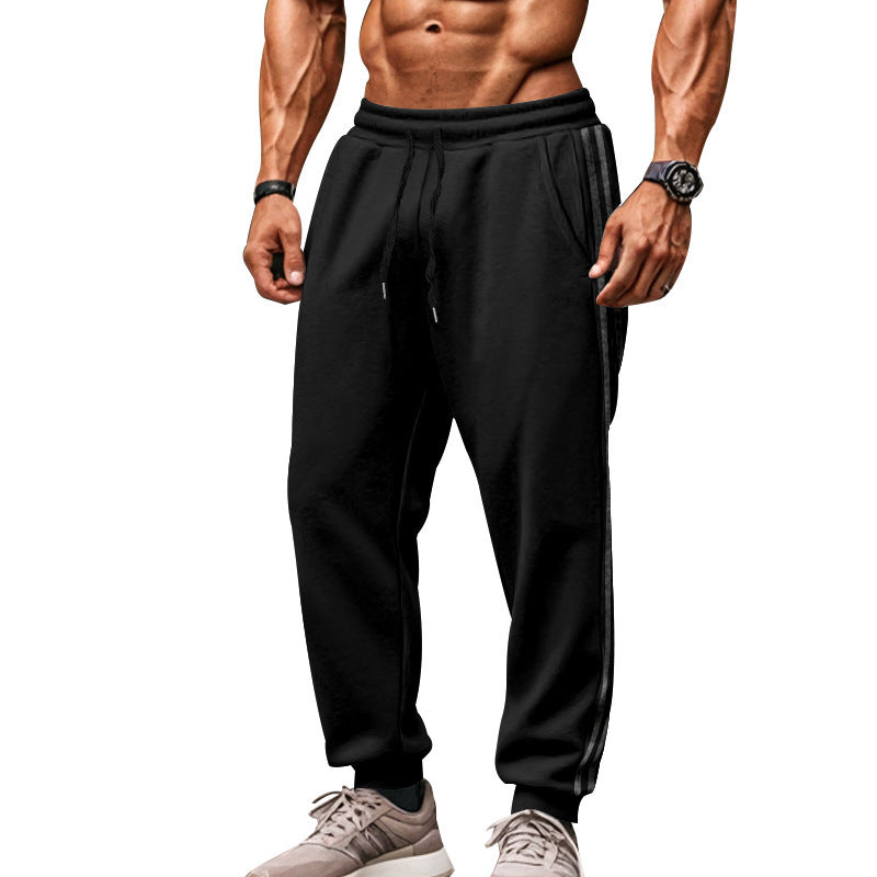 Men's sporty jogging pants with side contrast stripes, elastic drawstring waistband, and ribbed leg endings Mune Fashion