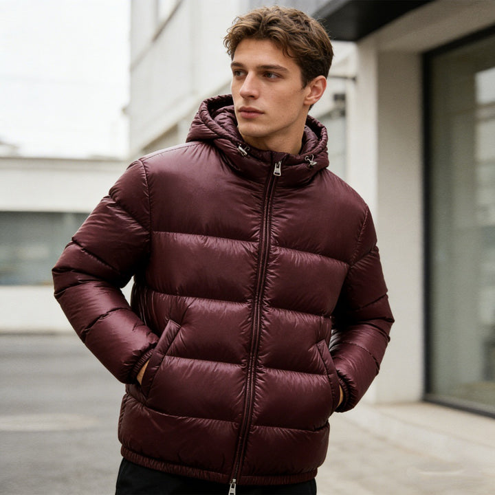 Men's quilted hooded jacket with glossy surface, warm synthetic filling and two-way zipper Mune Fashion
