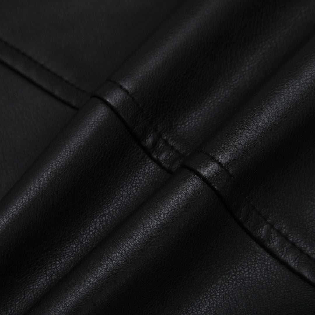 Women's short jacket made of faux leather with round neck, snap button closure, and flap pockets Mune Fashion