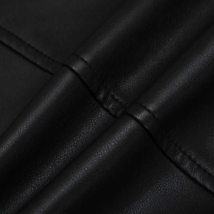 Women's short jacket made of faux leather with round neck, snap button closure, and flap pockets Mune Fashion