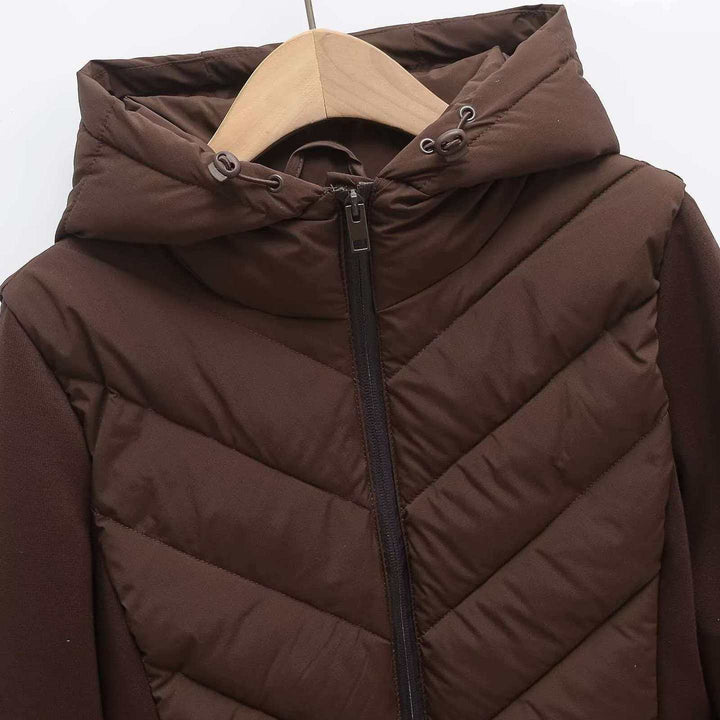 Women's quilted hooded jacket with chevron quilting, softshell inserts, and concealed zipper Mune Fashion