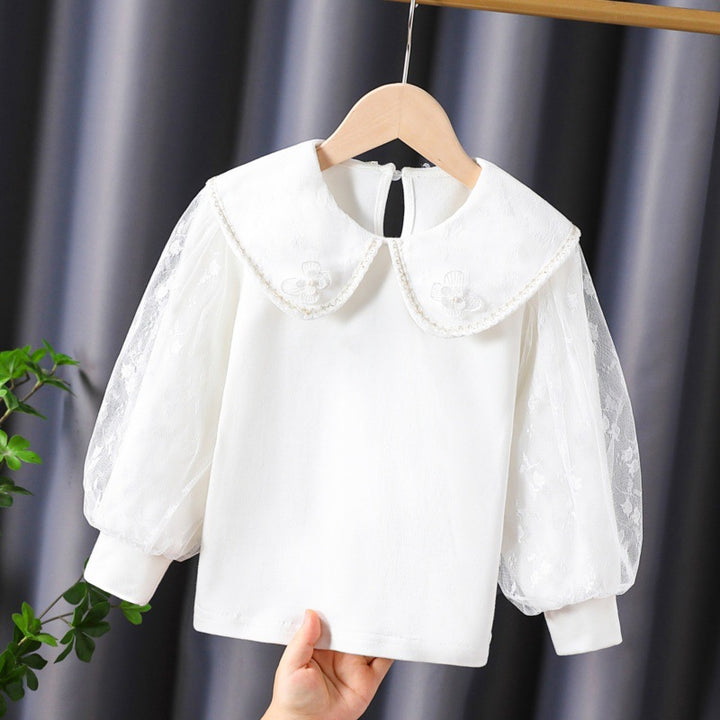 Women's blouse with decorative floral appliqués and transparent puff sleeves Mune Fashion