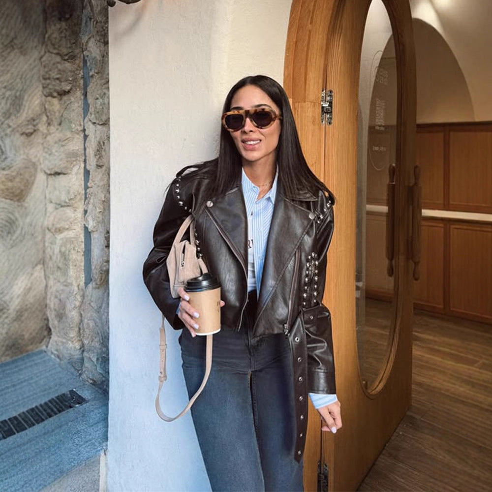 Women's Short Studded Biker Jacket Made of Faux Leather with Waist Belt Mune Fashion