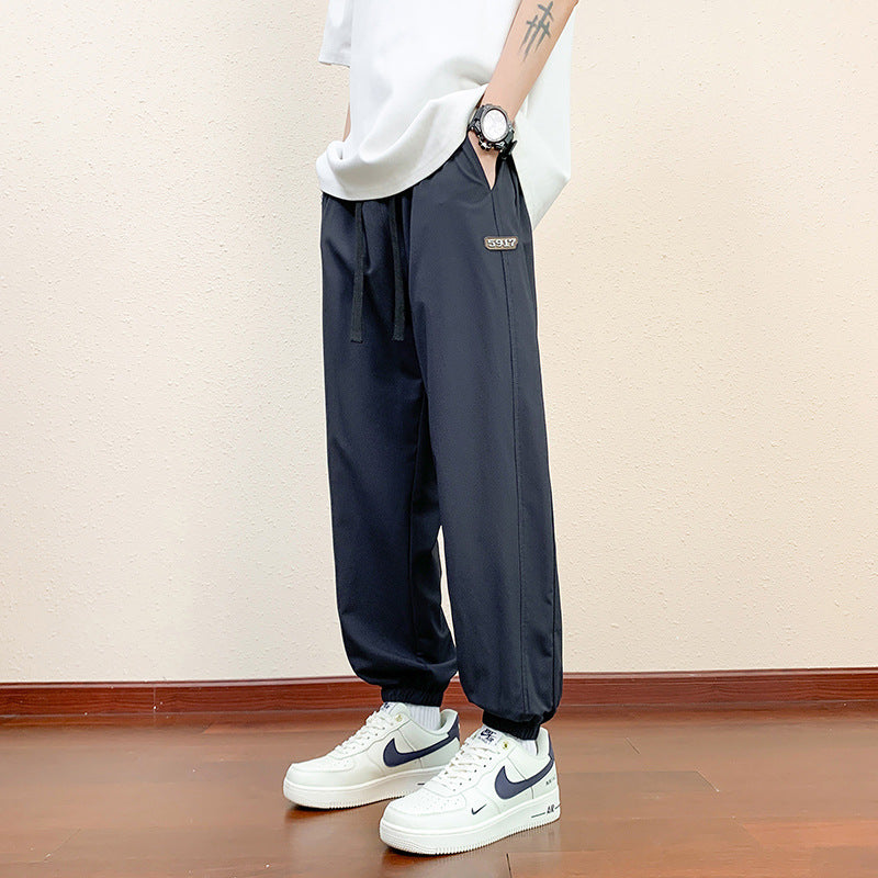 Men's sporty jogging pants with reflective details