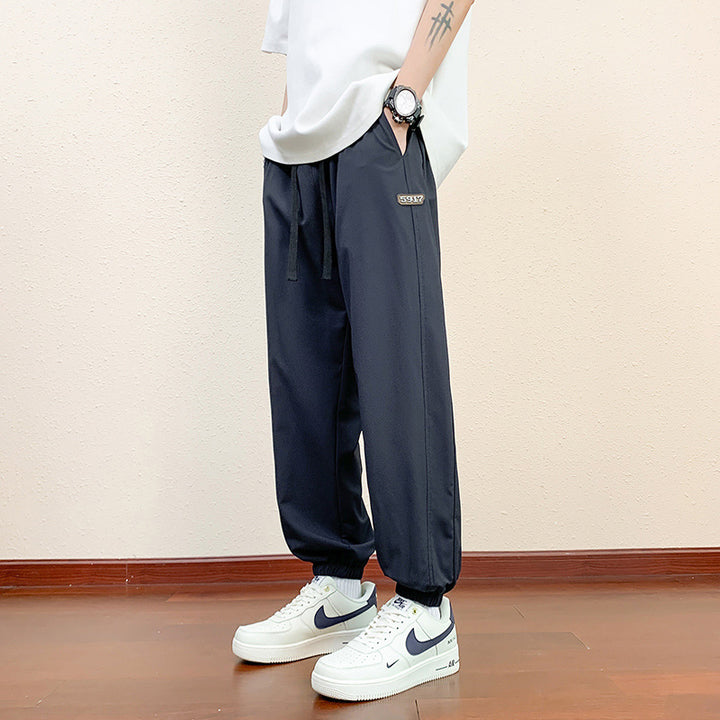 Men's sporty jogging pants with reflective details