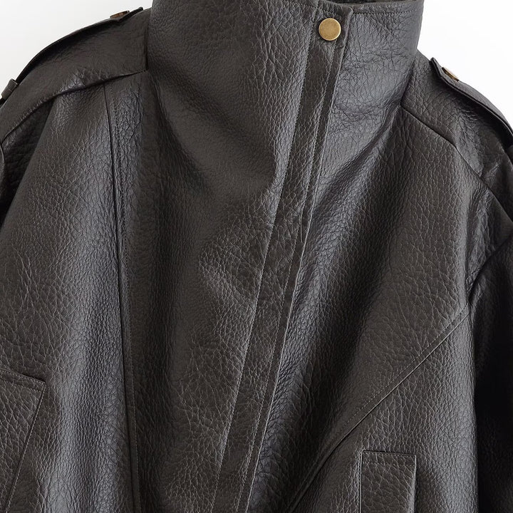 Women’s short jacket in aviator style made of synthetic leather with high standing collar, shoulder straps, and fitted ribbed hem Mune Fashion