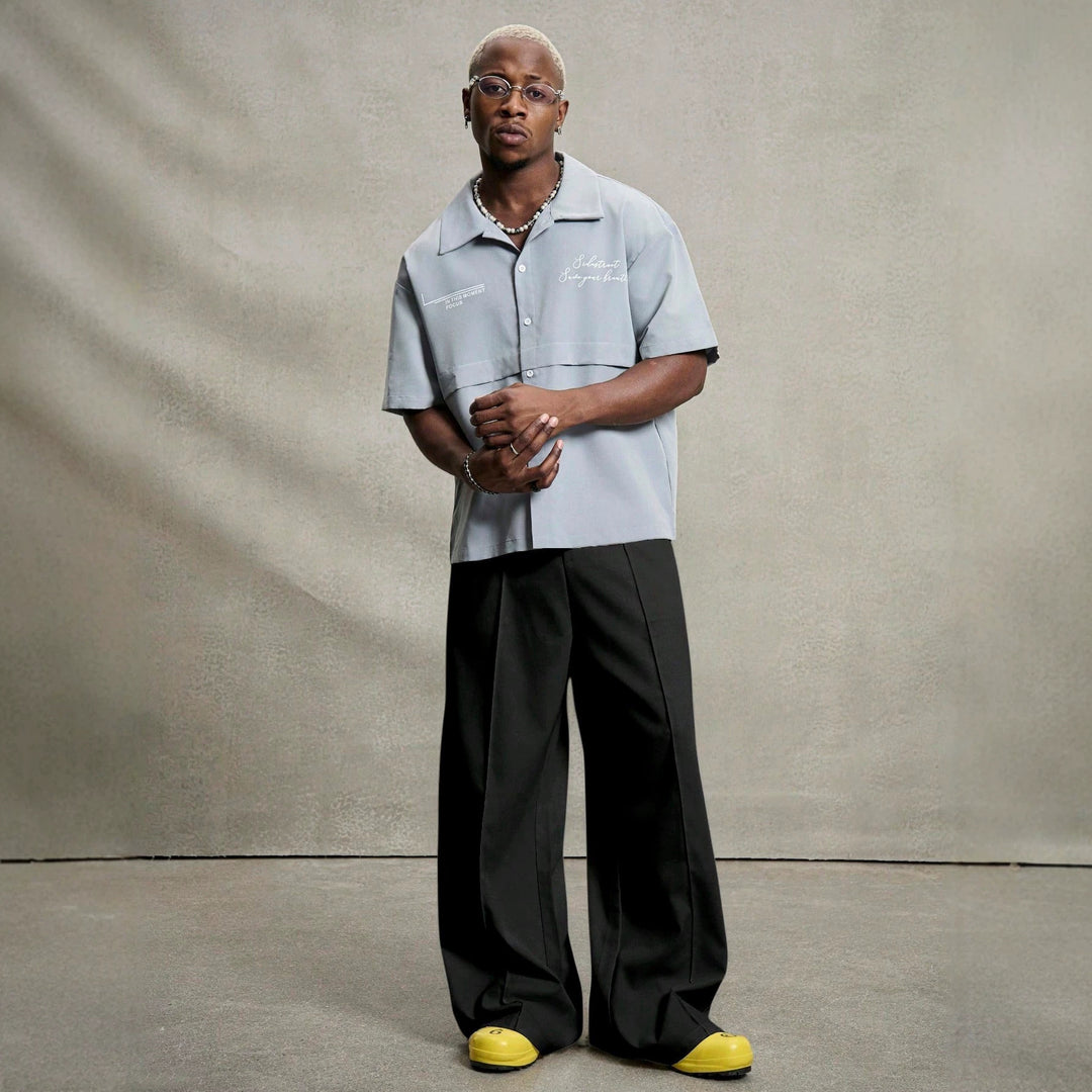 Men's wide pleated pants with high waistband, precise creases, and side inset pockets Mune Fashion