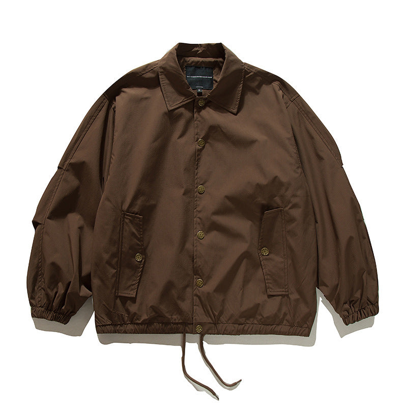 Unisex Boxy transitional bomber jacket with drawstring hem and snap button placket Mune Fashion