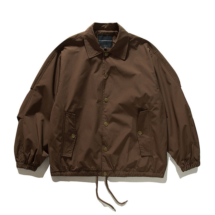 Unisex Boxy transitional bomber jacket with drawstring hem and snap button placket Mune Fashion