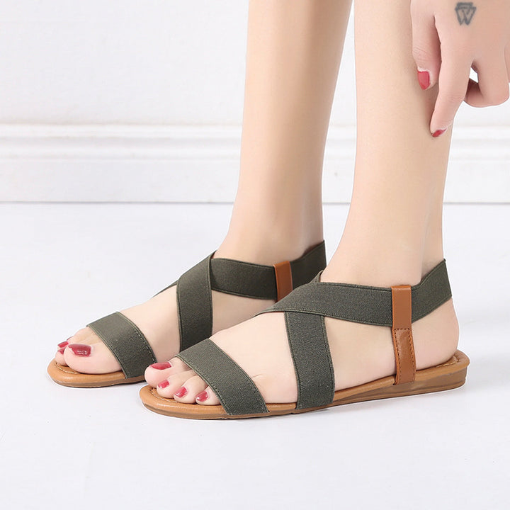 Women's flat elastic strap sandals with crossed stretch bands and padded comfort footbed Mune Fashion