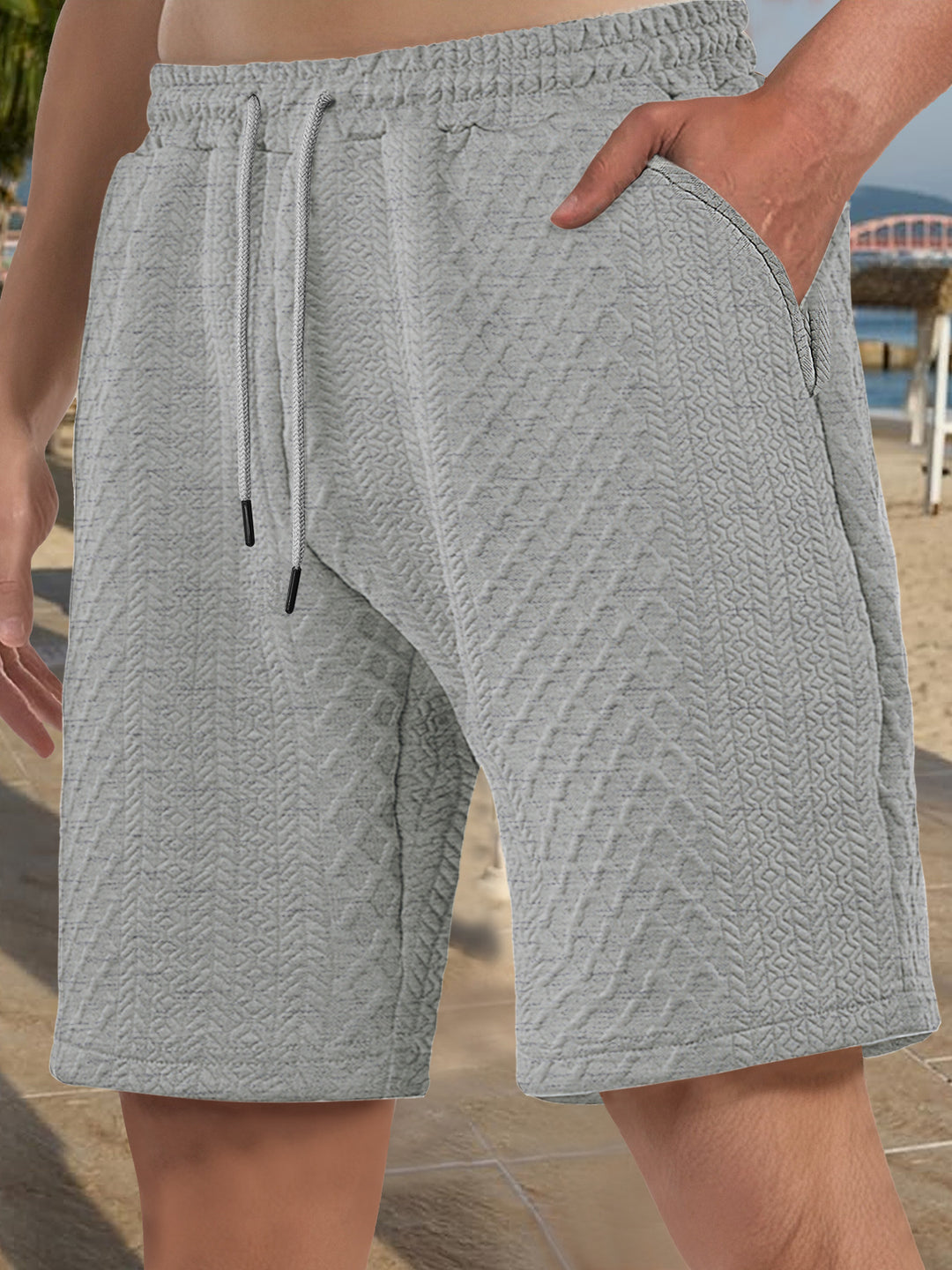 Men's textured beach bermuda shorts made of waffle jersey with elastic drawstring waistband and slanted pockets Mune Fashion