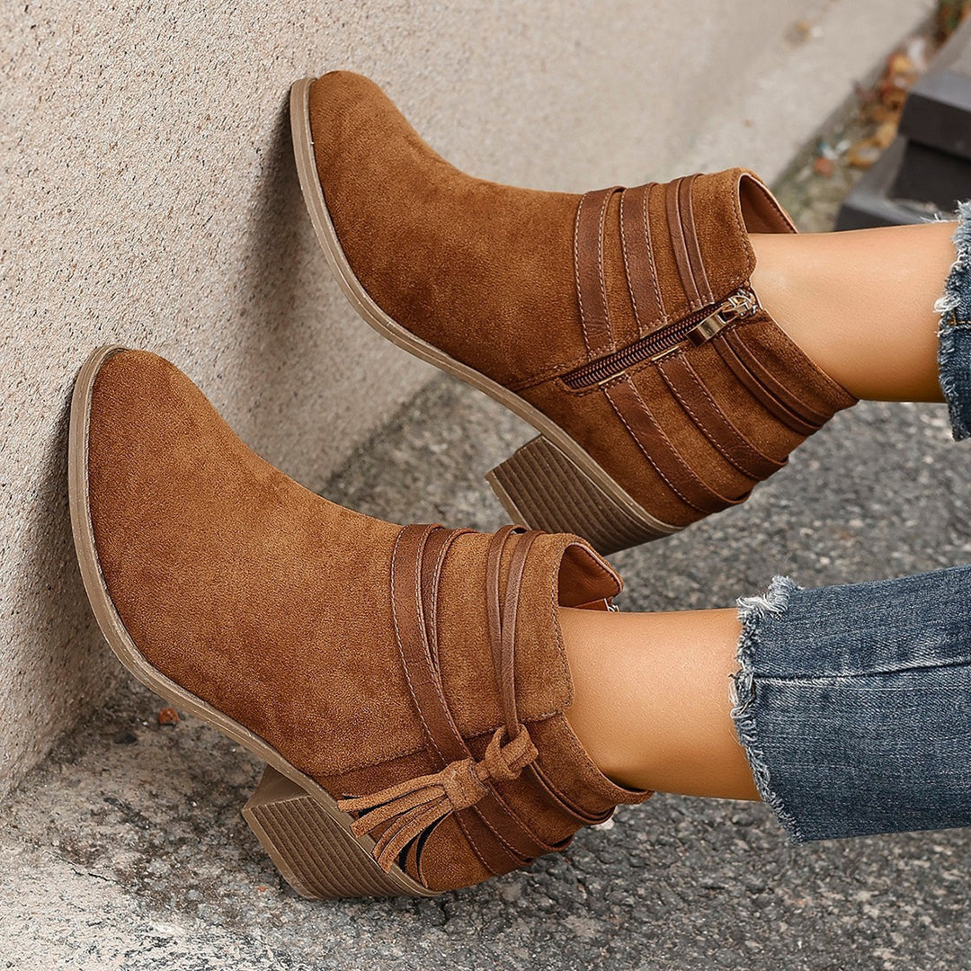 Ladies faux suede ankle boots with decorative straps, tassels, and side zipper Mune Fashion