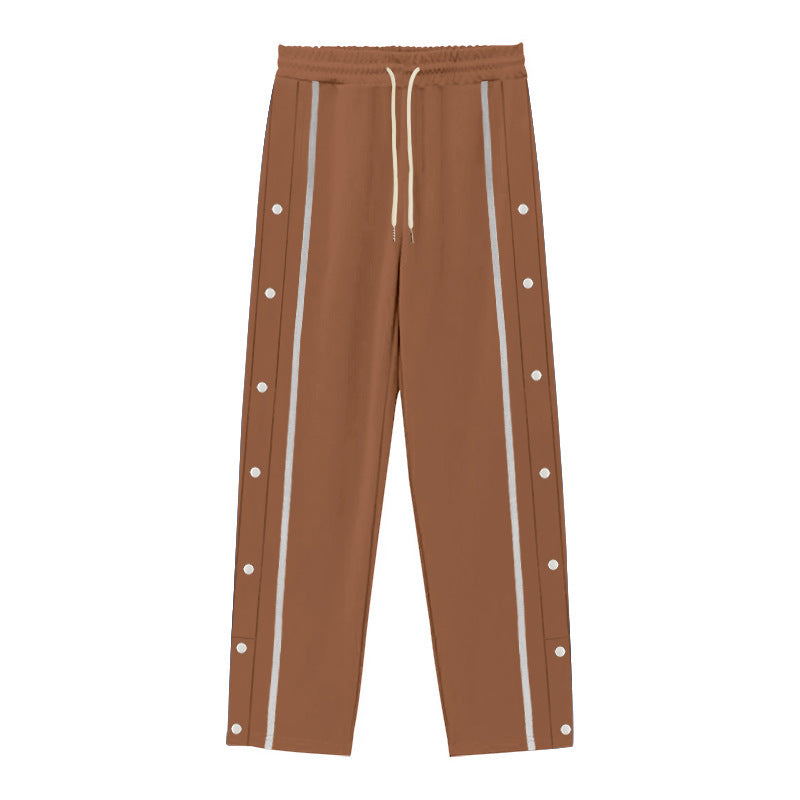 Men's Nan sporty jogging pants with side snap button placket, elastic drawstring waistband, and striking side stripes Mune Fashion