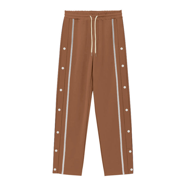 Men's Nan sporty jogging pants with side snap button placket, elastic drawstring waistband, and striking side stripes Mune Fashion