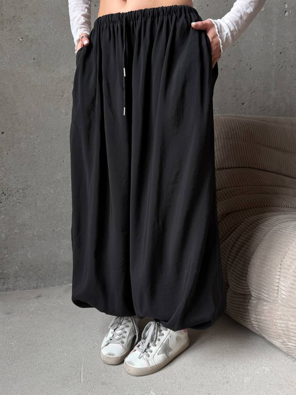 Women's wide harem balloon pants with high elastic waistband, drawstring, and casual wide fit.