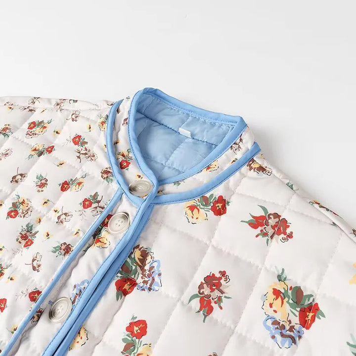 Women's padded boxy jacket with floral all-over print, contrasting piping and patch flap pockets Mune Fashion