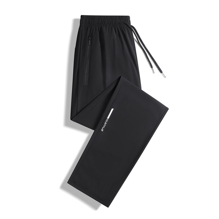 Men's sporty jogging pants with elastic waistband and practical zip pockets Mune Fashion
