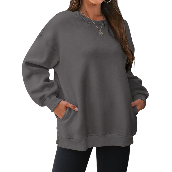 Women's extended oversized round neck sweater with side pockets, ribbed cuffs, and dropped shoulder Mune Fashion