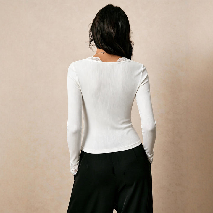 Women's fine ribbed long-sleeve shirt with lace V-neck, decorative bow and lace cuffs Mune Fashion
