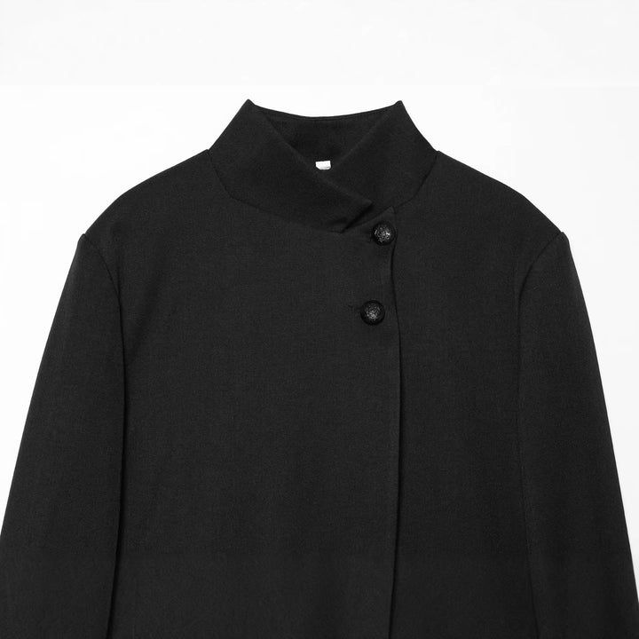 Women’s short-cut blazer with stand-up collar, asymmetrical closure, and piping pockets Mune Fashion