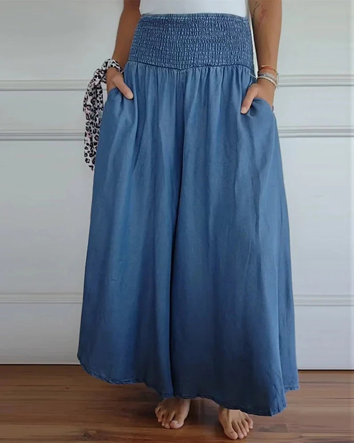 Women's maxi skirt with high smock waistband, wide fall and side pockets Mune Fashion
