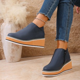 Women's Mune Fashion ankle boot with wedge heel, side zipper, and padded comfort insole