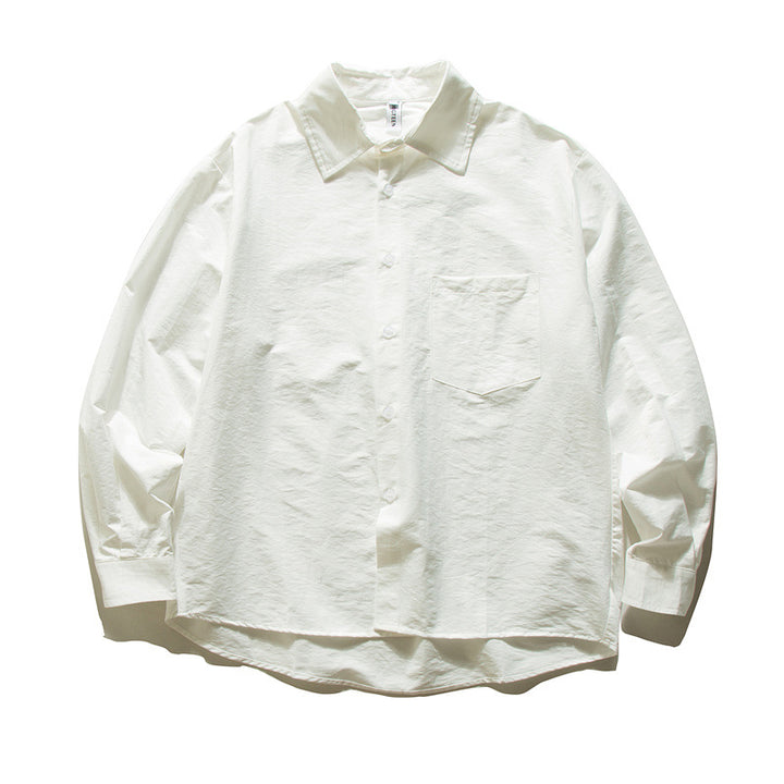 Unisex Oversize cotton shirt with boxy cut, breast pocket, and rounded hem Mune Fashion