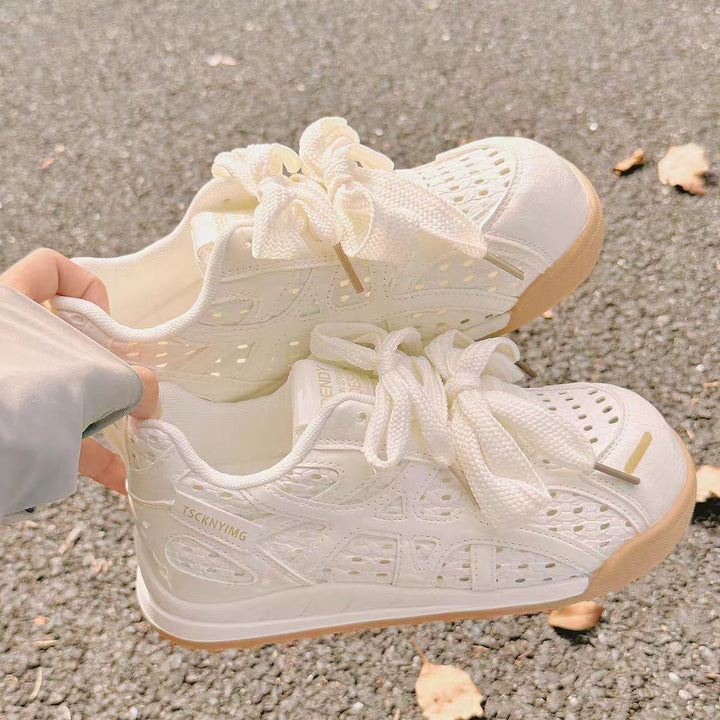 Ladies sporty platform sneakers with perforated upper material and decorative bows Mune Fashion