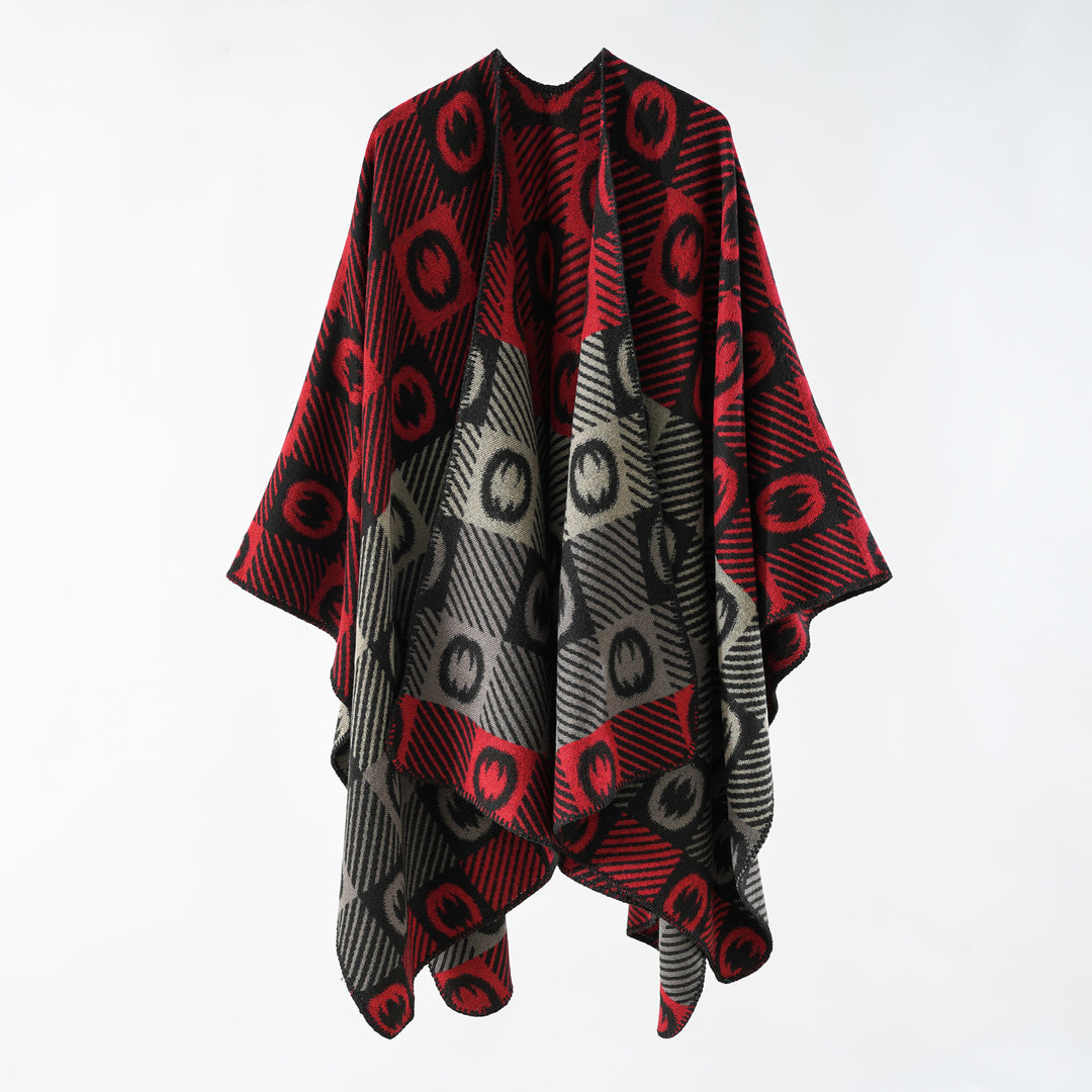 Women's jacquard wrap poncho made of fine knit with graphic circle jacquard and open kimono silhouette.