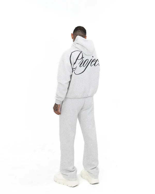 Men's wide comfort trousers with straight leg, elastic drawstring waistband, subtle logo embroidery, and fine speckled look Mune Fashion