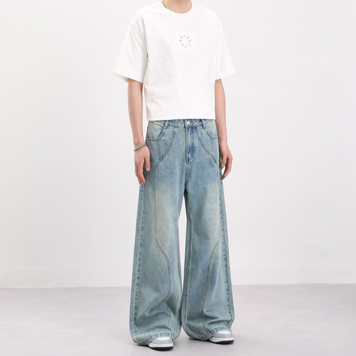 Men's wide-cut denim palazzo pants with curved seam panels and extra-long hem Mune Fashion