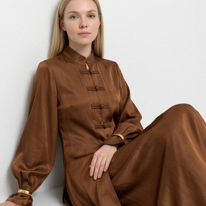 Women’s maxi dress with stand-up collar, traditional knot closure, and balloon sleeves Mune Fashion