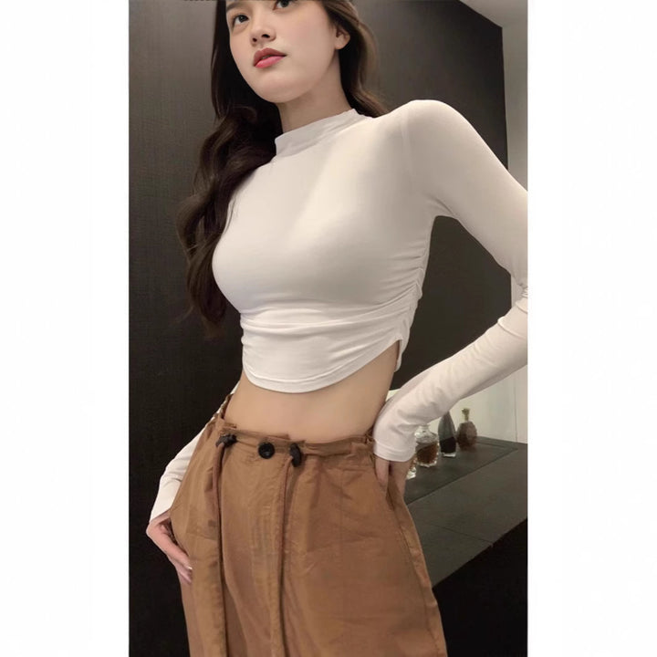 Ladies form-fitting long sleeve cropped top with stand-up collar, side gathering and extended sleeves Mune Fashion