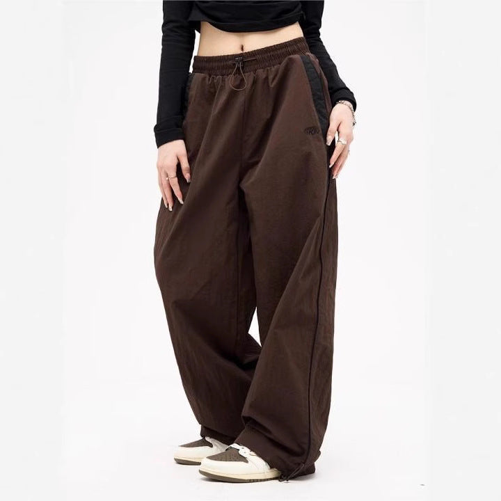 Women's wide track pants with contrast piping, elastic waistband and oversized fit Mune Fashion