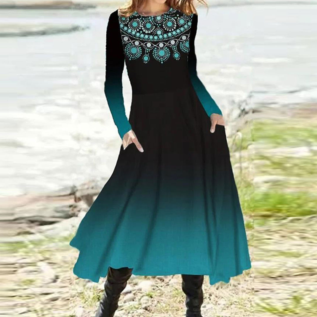 Women's flowing maxi dress with tie-dye circle pattern, round neckline, waist seam, and side pockets Mune Fashion
