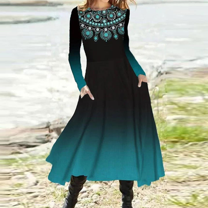 Women's flowing maxi dress with tie-dye circle pattern, round neckline, waist seam, and side pockets Mune Fashion