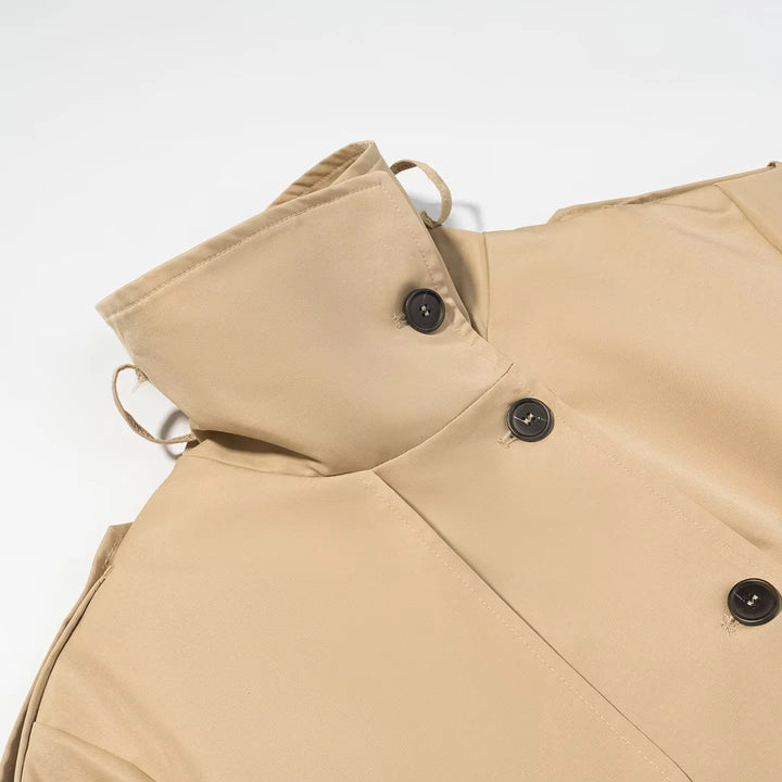 Women's tailored short trench coat with stand-up collar, epaulettes, and tie belt Mune Fashion