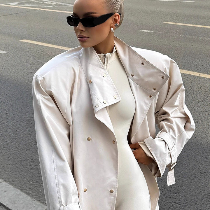 Women’s short trench coat in oversized look with extra wide lapel and snap button closure Mune Fashion