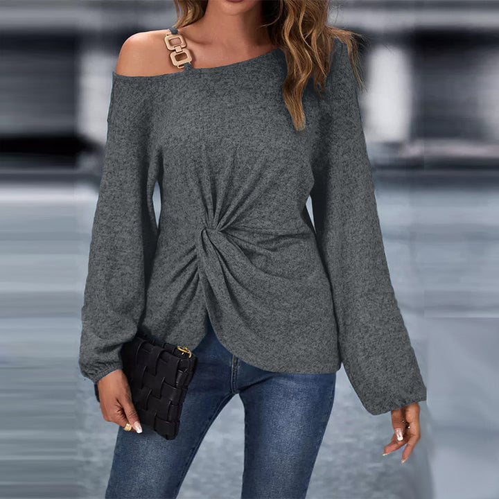 Women’s asymmetrical off-shoulder knit sweater with decorative chain strap and twisted knot front Mune Fashion
