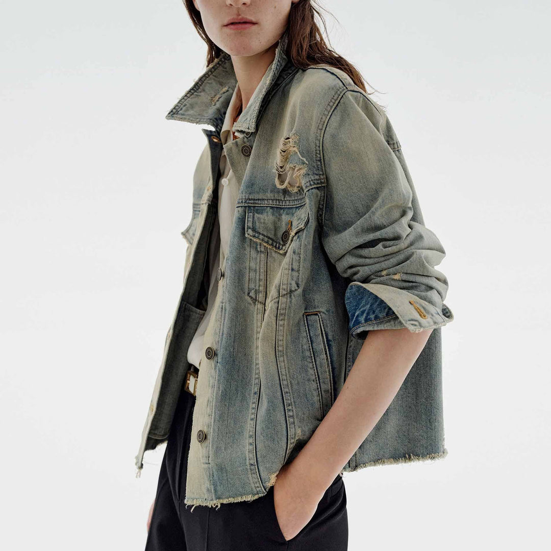 Women’s oversized destroyed denim jacket with raw hem, patch chest pockets, and vintage wash Mune Fashion