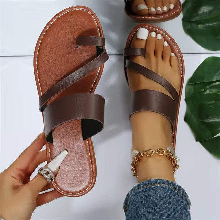 Women's flat faux leather thong sandal with crisscross straps and padded comfort footbed Mune Fashion