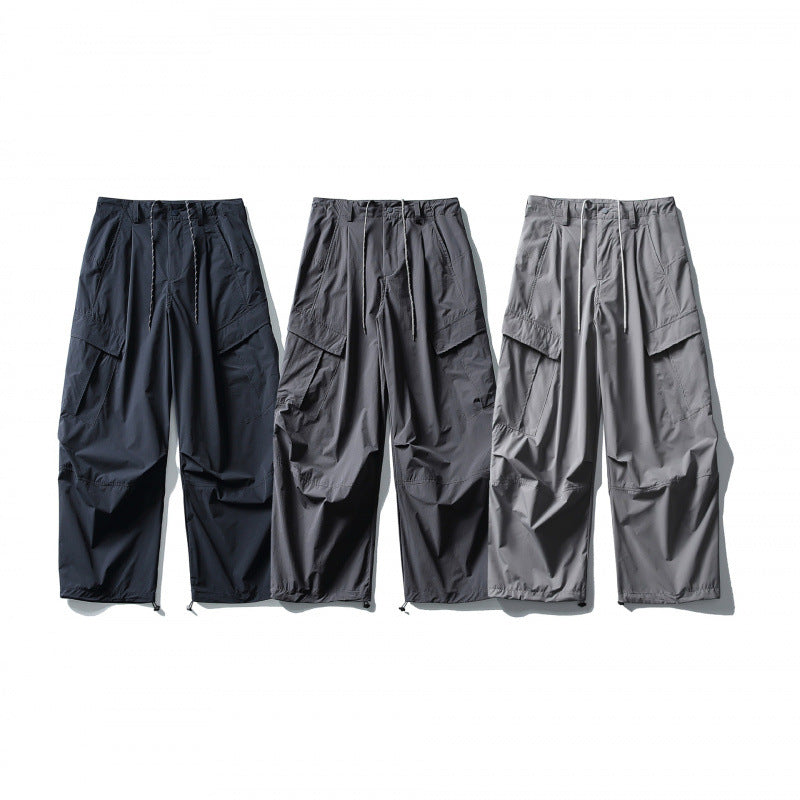 Men's loose technical cargo pants with drawstring waistband and adjustable leg closures Mune Fashion