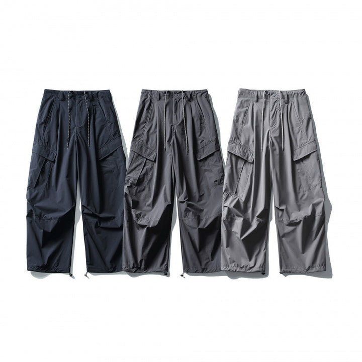 Men's loose technical cargo pants with drawstring waistband and adjustable leg closures Mune Fashion