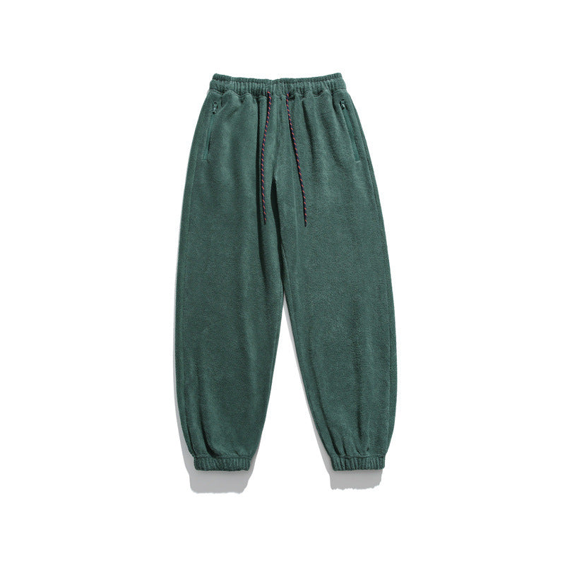 Men's wide-cut fleece jogging pants with elastic cuffs and side pockets Mune Fashion