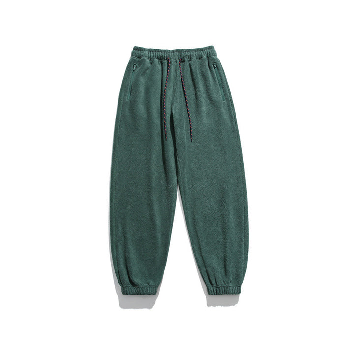 Men's wide-cut fleece jogging pants with elastic cuffs and side pockets Mune Fashion