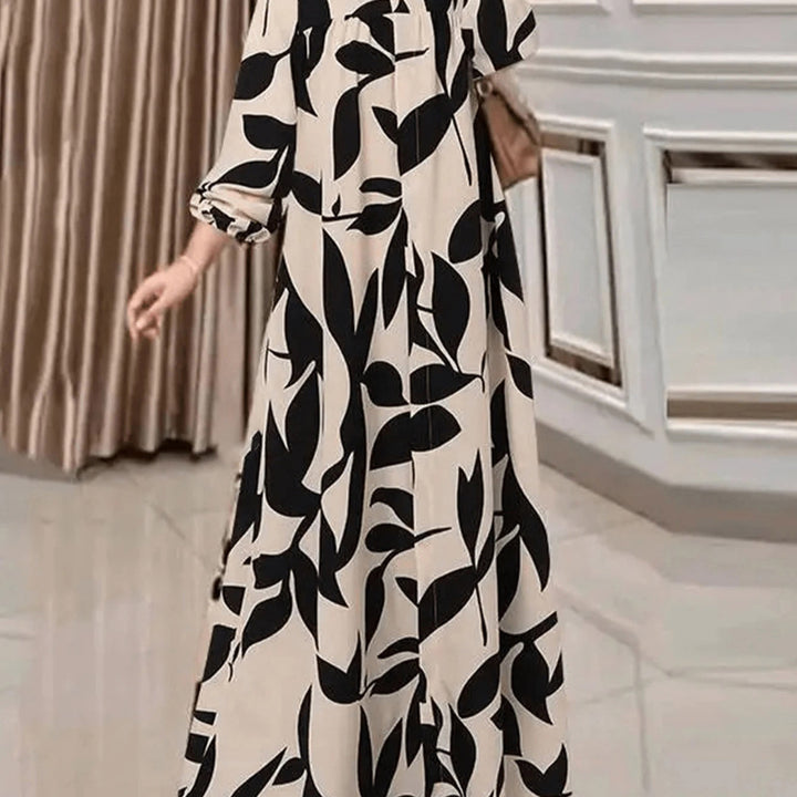 Women's maxi dress with loose A-line cut, flowing fit and eye-catching leaf print Mune Fashion