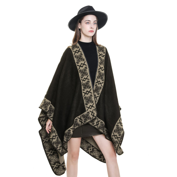Women's oversized poncho cape made of wool blend with woven border jacquard and decorative chain stitch